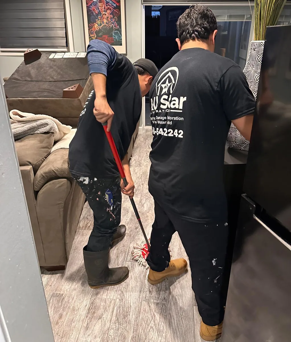 All Star Restoration crew cleaning and sanitizing a floor during a Brooklyn cleanup