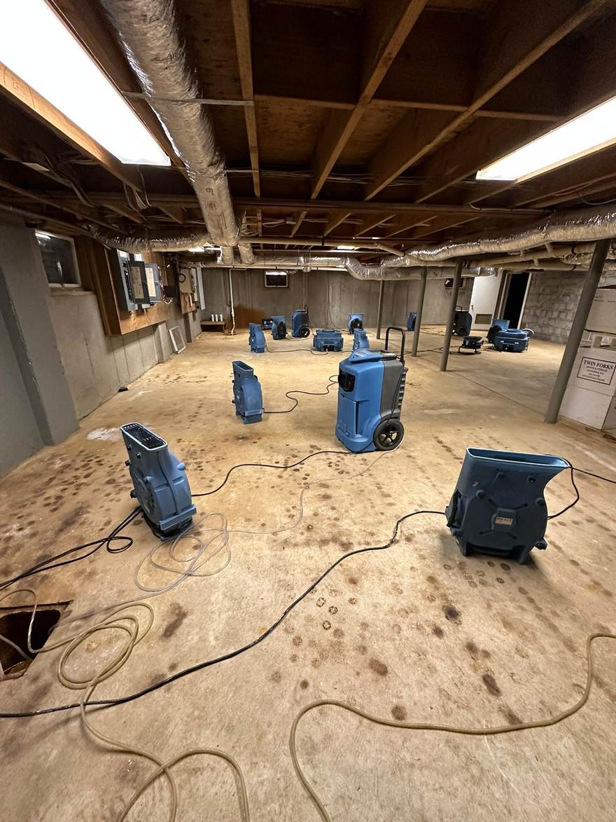 Drying equipment running in the cleared basement after mold remediation in Brooklyn, NY
